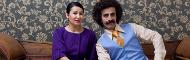 woman in purple and man in blue vest